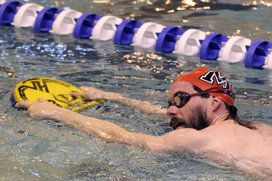 Alumni swimmers warm up before the races begin. For many, this race is the first they have competed in since high school or college.