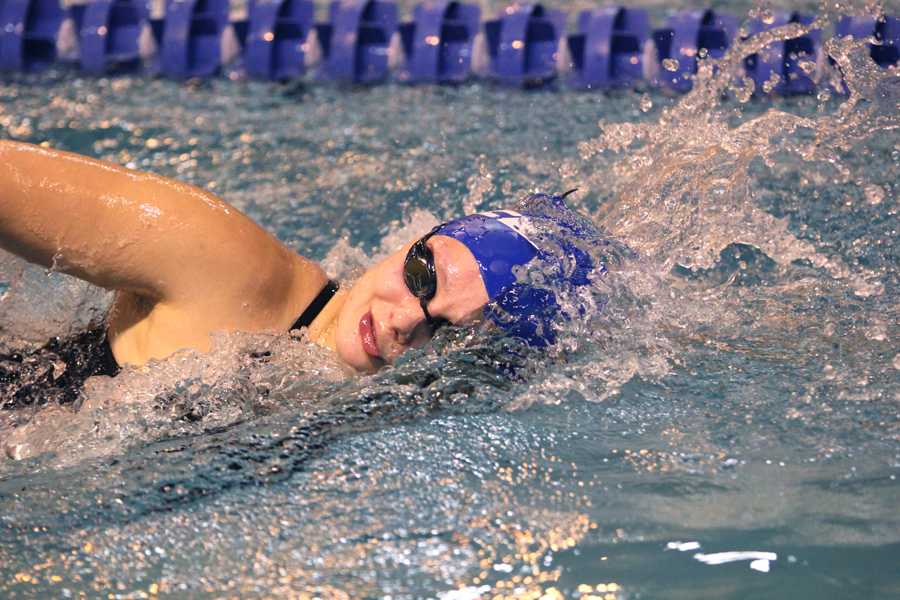 Elizabeth Markiewicz (‘13) swims in her freestyle race. Though Markiewicz is a recent graduate, she still swam in the meet.