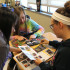 Morgan Kelly (11), Jennifer Lindholm (11) and Marissa Grantham (11) search for party favors. The Junior Class Cabinet met on Wednesday, Feb. 19.