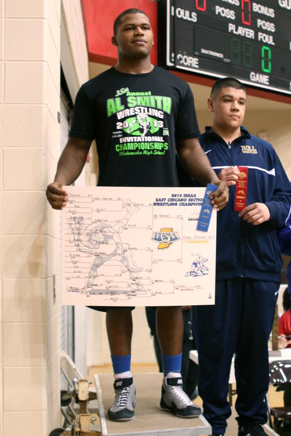 Gelen Robinson (12) stands at the winning spot on the podium. Robinson has won an individual Sectional Championship three times.