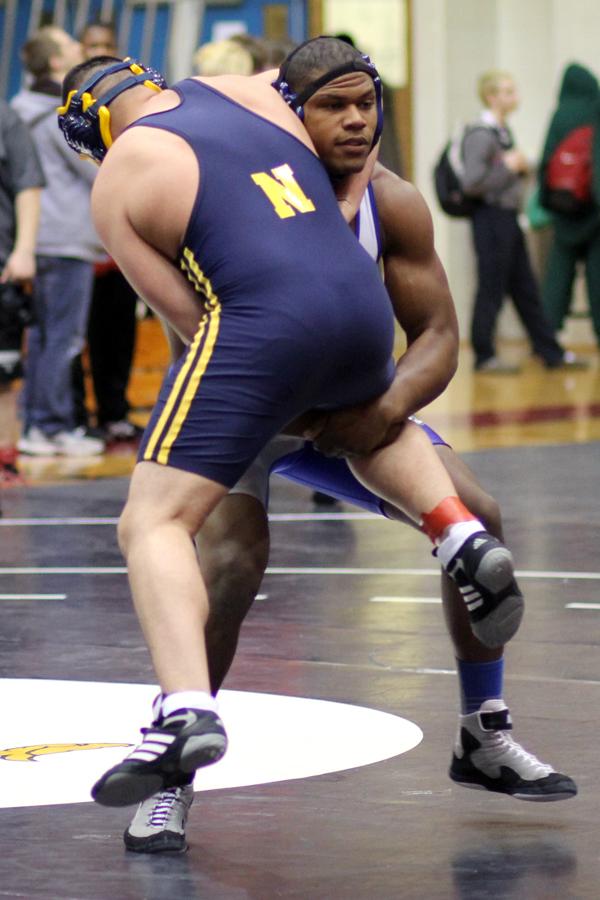 Gelen Robinson (12) effortlessly picks up his opponent. Robinson hopes to travel to state this year to defend his title.