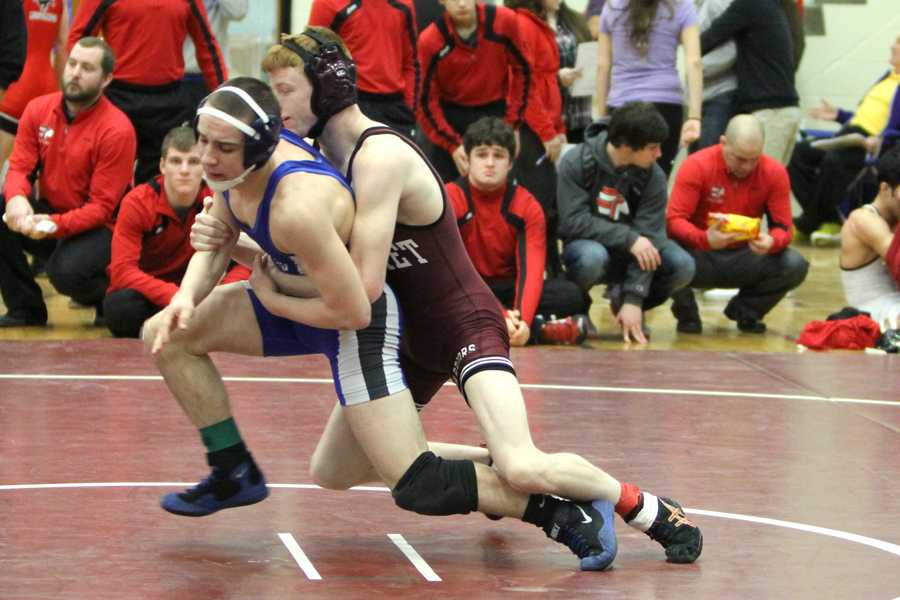 Antonio Presta (11) attempts to escape from his competitor. The Indians took third at Regionals as a team.