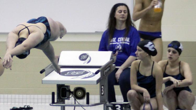 Maura Lake (11) starts the 400 freestyle relay. Varsity girls swimming lost 139-67 to the Penn Kingsmen.
