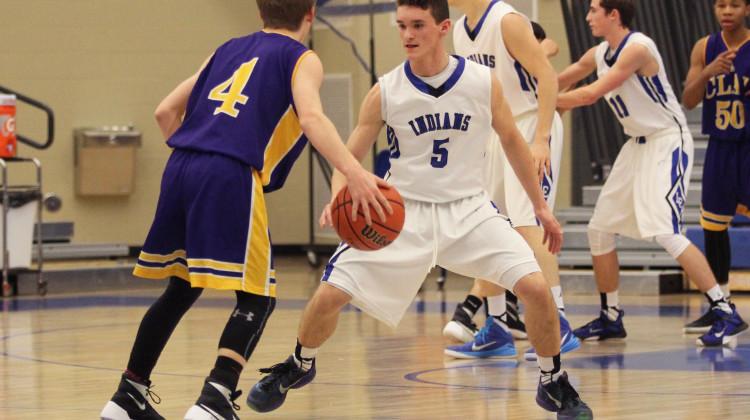 Conner Tomasic (10) tries to steal the ball back from the opposing team during the third quarter. The score at this time was 52-13.