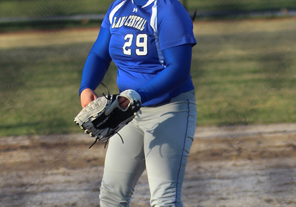 Pitcher Julia Schassburger (12) throws during the first inning. The varsity team beat Munster 9-3.