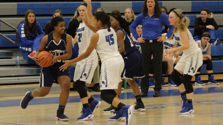 Players works to steal the ball from the opposing team. The team started a winning streak in their season.