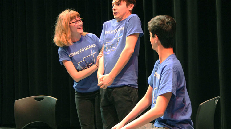 Emily Badger (12), Aaron Cappello (11) and Benjamin Basem (11) act in the skit “Vocal Lessons.” Badger was the overbearing mother of Cappello who was taking singing lessons with Basem.