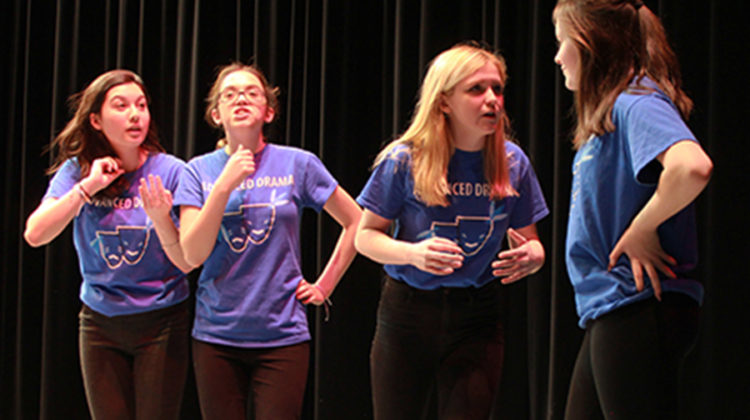 Ariana Kanaya (10), Emma Pederson (10), Isabella Gomez (12) and Olivia Lavoie acting their parts in a skit called Ghost Australian Brothers. Lavoie played a ghost that scared away multiple people interested in buying the house.