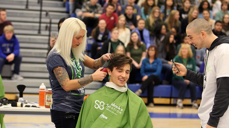 Nicholas Lucas (12) cringes when getting his head shaved. St. Baldricks was first held at Lake Central in 2005.