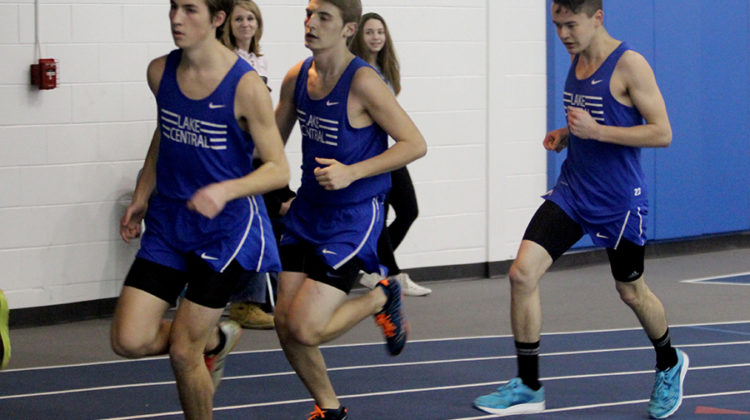 Andrew Ackerman (11), Nathan Previs (11) and Michael Clark (12) run the mile. The team lost a close meet against Crown Point.