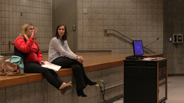 Gabrielle Rapin, Science, and Kelsey Becich, English, discussing about the new service hour place, Shirley's Heinze Volunteer program.