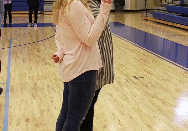 Abigail Hines (12) takes all the club photos. Nicole Milaszewski (12) offered her assistance by counting down for each of the club members to be prepared for their photos.