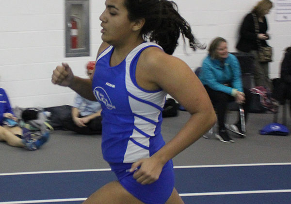 Jasmine Reyes (11) runs in the open 800 race. Reyes plans on becoming a varsity runner this season.