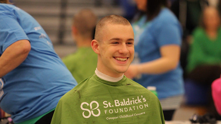 Alexander Taranowski (10) smiles while his head was getting shaved. The assembly was organized by the class of 2017.