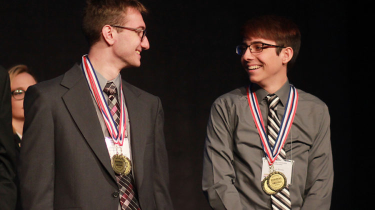 Zack Seliger (11) smiles at Preston Petrie (12) during the open events award category. Seliger placed second, and Petrie placed first.