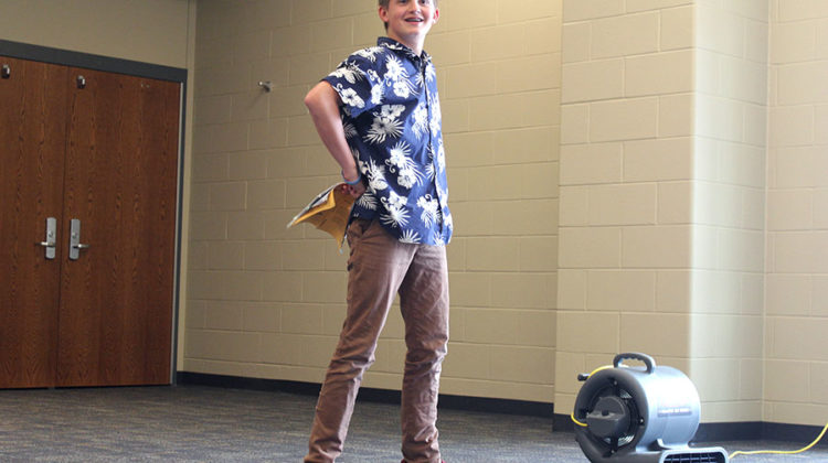 Trent Schneider (9) hops up from the floor and assumes a Peter Pan pose. Schneider was acting in “Peter/Wendy.”