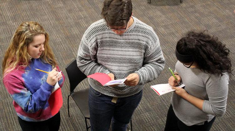 Madalyn Doot (9), Sammy Presta (10) and Nicole South (9) write down their blocking. Presta was needed to act in a freshman play because not enough males auditioned.