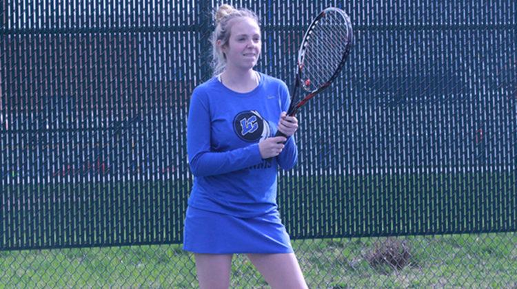 Holly Pasko (11) looks ahead and waits for the ball to be served over. Pasko was part of the first round of girls who played Tues. Apr. 11.