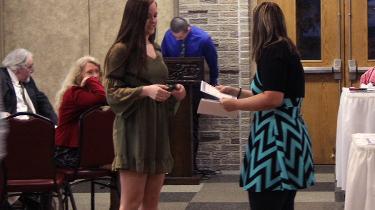 Marissa Denys (10) receives her certificate. The banquet lasted an hour and a half.