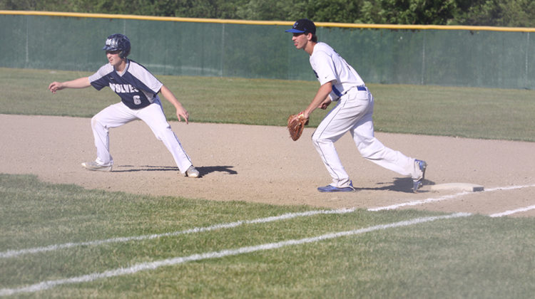 Jack Hilvert (10) tags first base with his right foot. Hilvert prepared to touch the runner if he tried to steal a base.