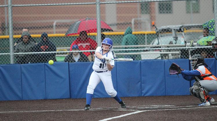 Jenna Towle (10) has her eye on the ball as she prepares to swing. The varsity softball team won 10-0.
