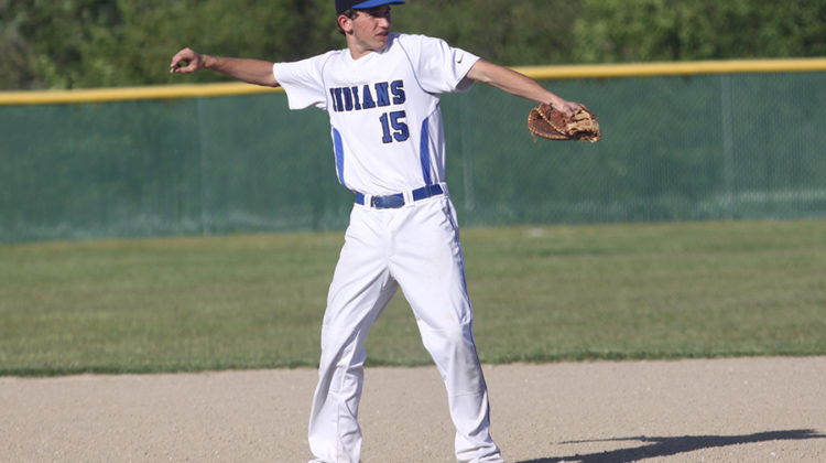 Jack Hilvert (10) throws a rock off the field to keep it from conflicting with the game. This was the Indians last home game of the season.