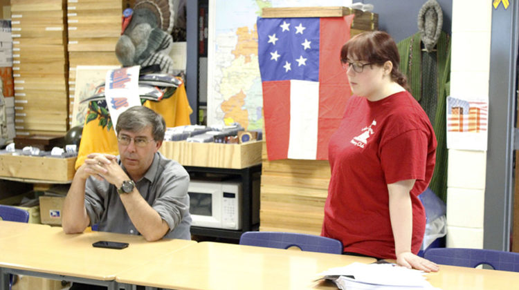 The club sponsor is Mr. Thomas Clark, Social Studies. One of the head officers, Caitlin Mavity (11), talked about upcoming events with the club sponsor.