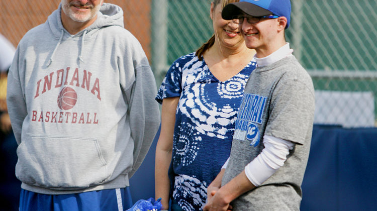 Nick Rossi (12) smiles as he is honored before the Varsity Softball game.