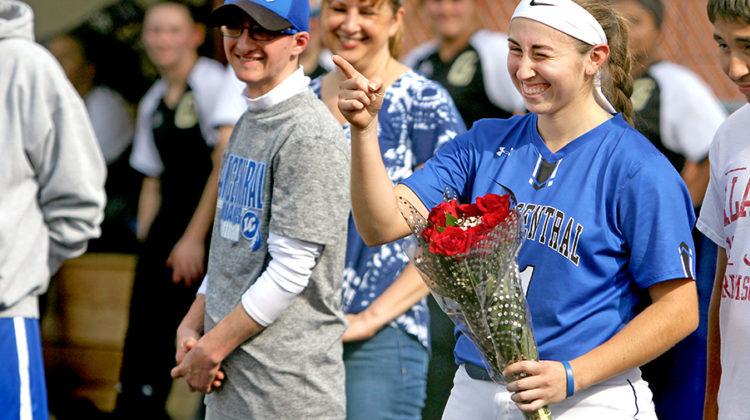 Cristal Guzman (12) winks after being handed flowers. Guzman was being honored before her last game.