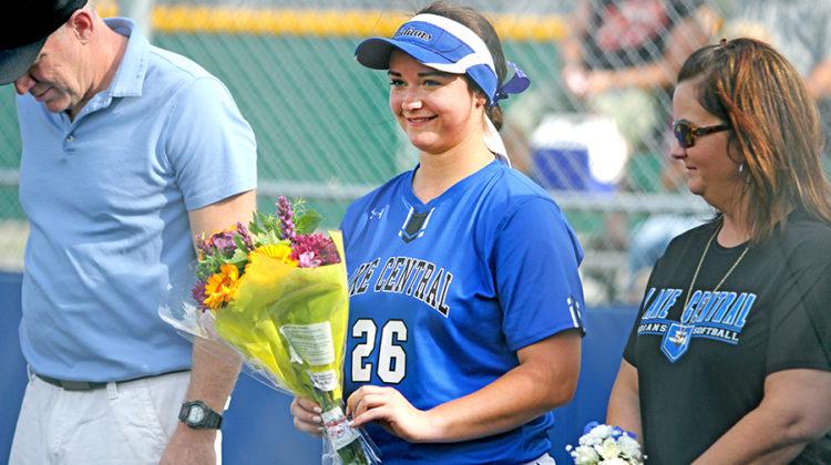 Alex Hickey (12) smiles after being handed flowers. LC won with the final score of 11-0.