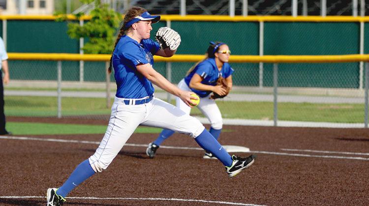 Alexa Pinarski (11) pitches the ball to a Griffith player. Griffith lost the game by 11 points.