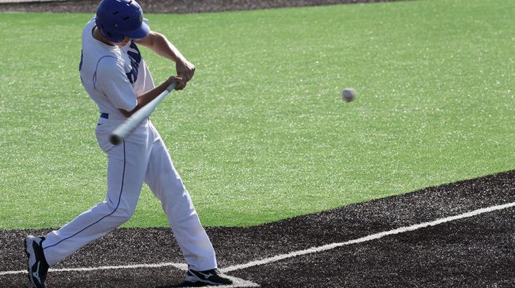 Evan Hand (10) swings at an oncoming pitch. The boys beat Illiana with a final run score of 5-2.