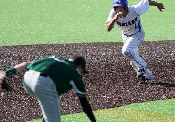Jake Dykstra (10) attempts to beat his opponent to third base. Dykstra scored two runs during the game.