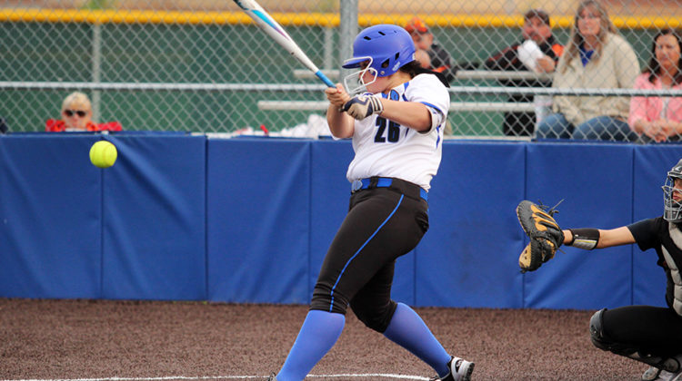 Alex Hickey (12) hits the ball. Hickey played first base for the Indians.