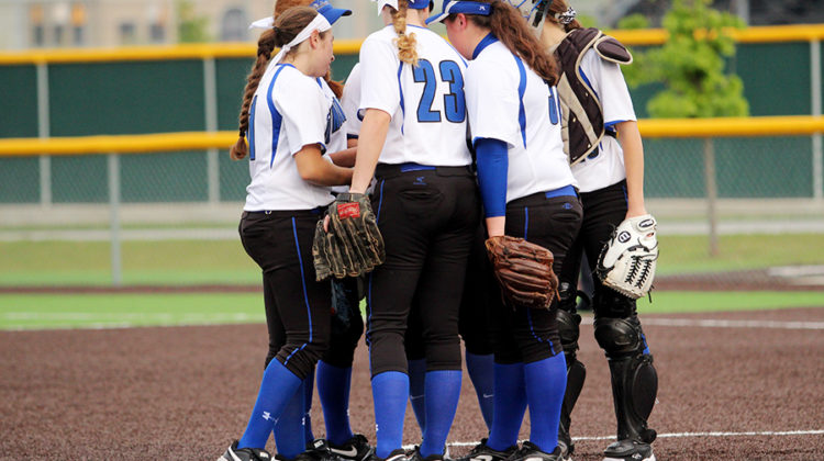 The infield gathers for a talk before the start of the inning. Lake Central went on to beat Laporte 2-1.