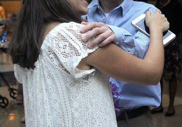 Sarah Tellas (11) and Nicholas Rossi (12) smile as the night goes on. The dance was held in the Cafeteria after school.