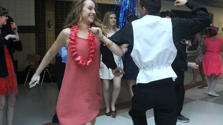 Christian Huber (12) skips with Elly Gross (11) to “The Chicken Dance.” Parents and teachers were welcome to join the dance floor.