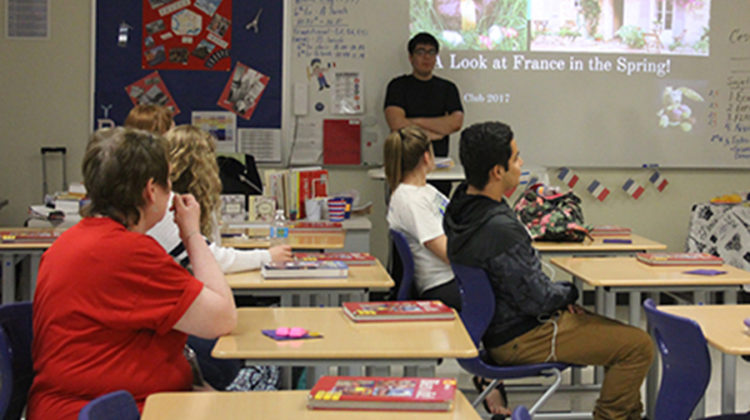 French club’s president, Theodore Mantis (10) opens the club meeting with a powerpoint. The topic was French traditions in spring.