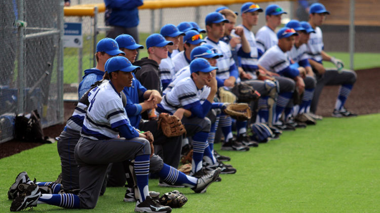 The baseball team watches the LaPorte Slicers during their warm up. The final score was 3-2, LC.