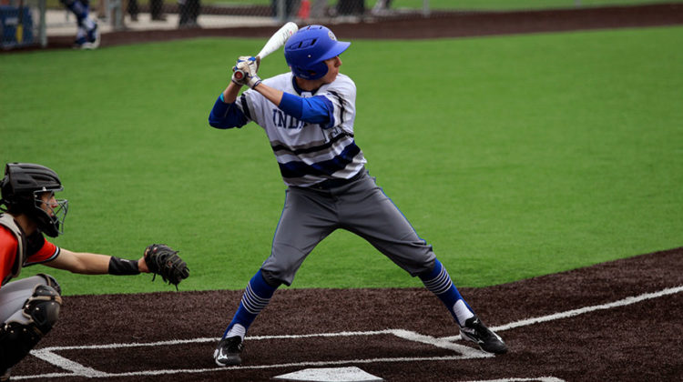 Jarret Lopez (12) gets ready to bat. He has been playing on the team all four years.