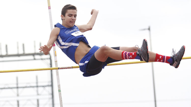 Douglas Belcaster (9) clears the bar in the pole vault event. Belcaster was one of the two pole vaulters that competed at this meet.