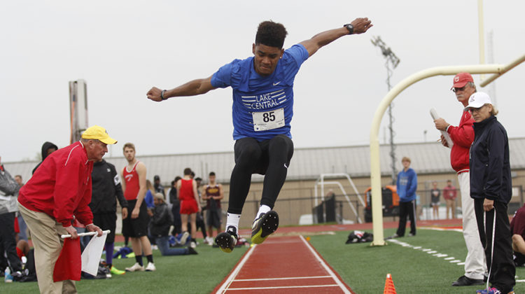 Keon Sellers (11) leaps in the air for his second jump in the long jump event. Many of the field events like long jump brought in a large amount of points for the whole team.