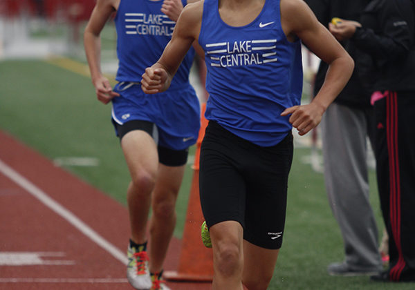 Isaac Beatty (10) races ahead of fellow teammate Andrew Ackerman (12) in the mile run. Ultimately, Ackerman was the first Lake Central runner to finish in this event.