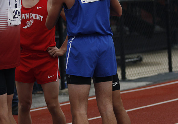 Andrew Ackerman (12) and Isaac Beatty (10) embrace after the mile run. They were the only two Lake Central runners in the event.