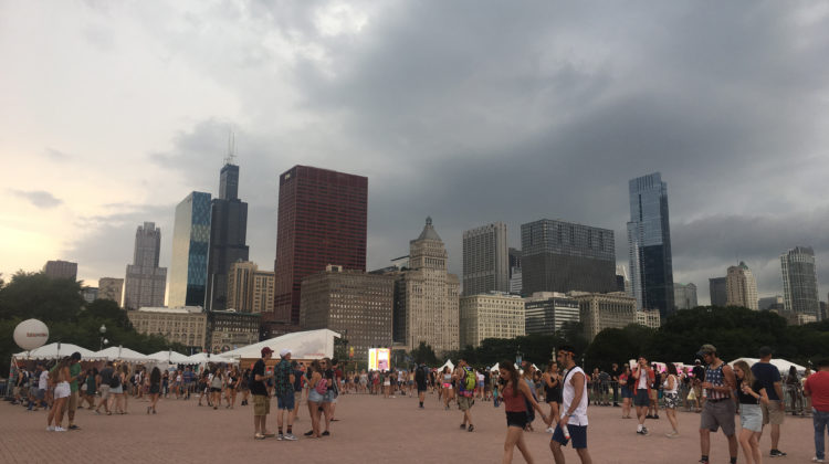 Lollapalooza goers waiting for rain to pass by the fountain. Grant Park was evacuated on Thursday, August 3rd.