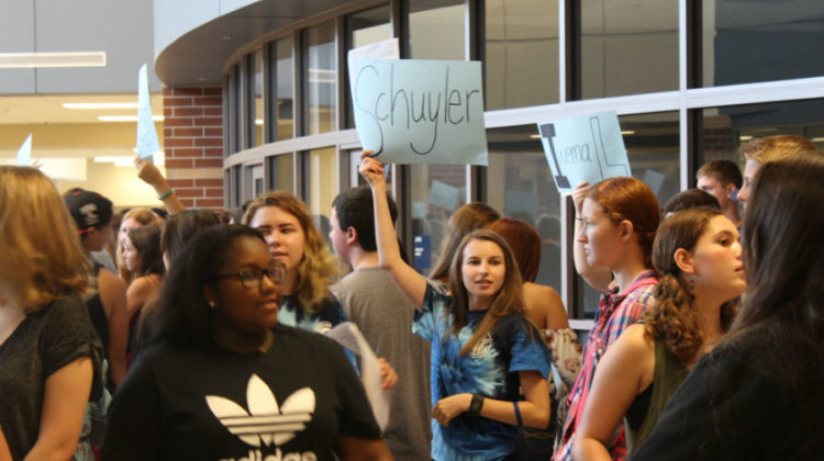 Rachel Eder (12) searches for her group in the sea of new students. At the start of the rush, each mentor stood with signs of a PTE teacher’s names to easily assemble groups.