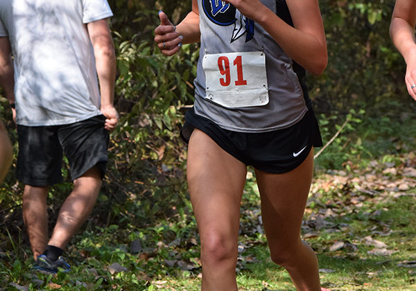 Hannah Roth (10) runs her second lap during the DAC race. Roth was running at a comfortable pace, but still made sure to keep a good time.