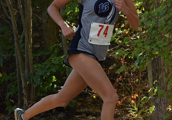 Gabrielle Devries (11) begins her second lap in this course. She made a narrow turn around the corner to maintain her place.