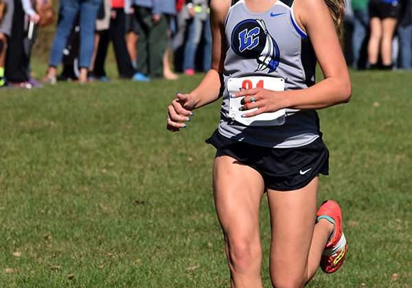 Hannah Roth (10) races to the finish line. She had just completed her third and final lap.