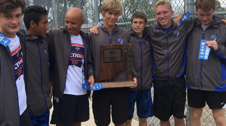 The boys cross country team poses with their Sectionals trophy. The team took first place at
Sectionals.